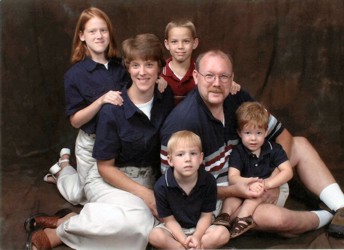 A family portrait - Steve and Mindy surrounded by Megan, Christopher, Cameron and Patrick, all dressed in blue